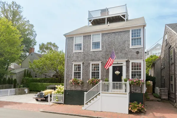 a front view of a house with a porch