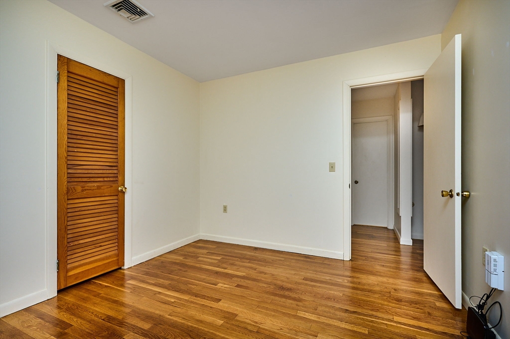 72 North Main Street New Salem, MA 01355 - Photo 11 of 29 a view of an empty room with wooden floor and a window