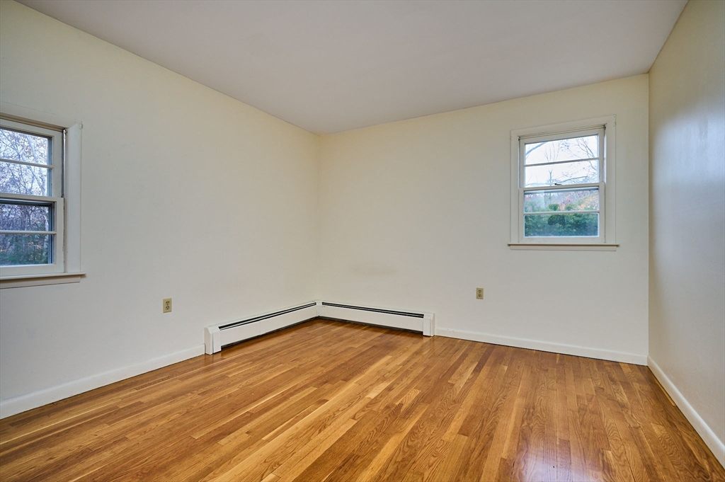 72 North Main Street New Salem, MA 01355 - Photo 12 of 29 an empty room with wooden floor and windows