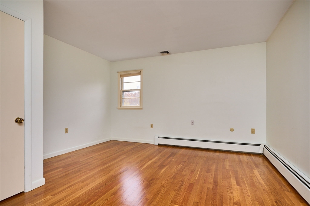 72 North Main Street New Salem, MA 01355 - Photo 14 of 29 an empty room with wooden floor and windows