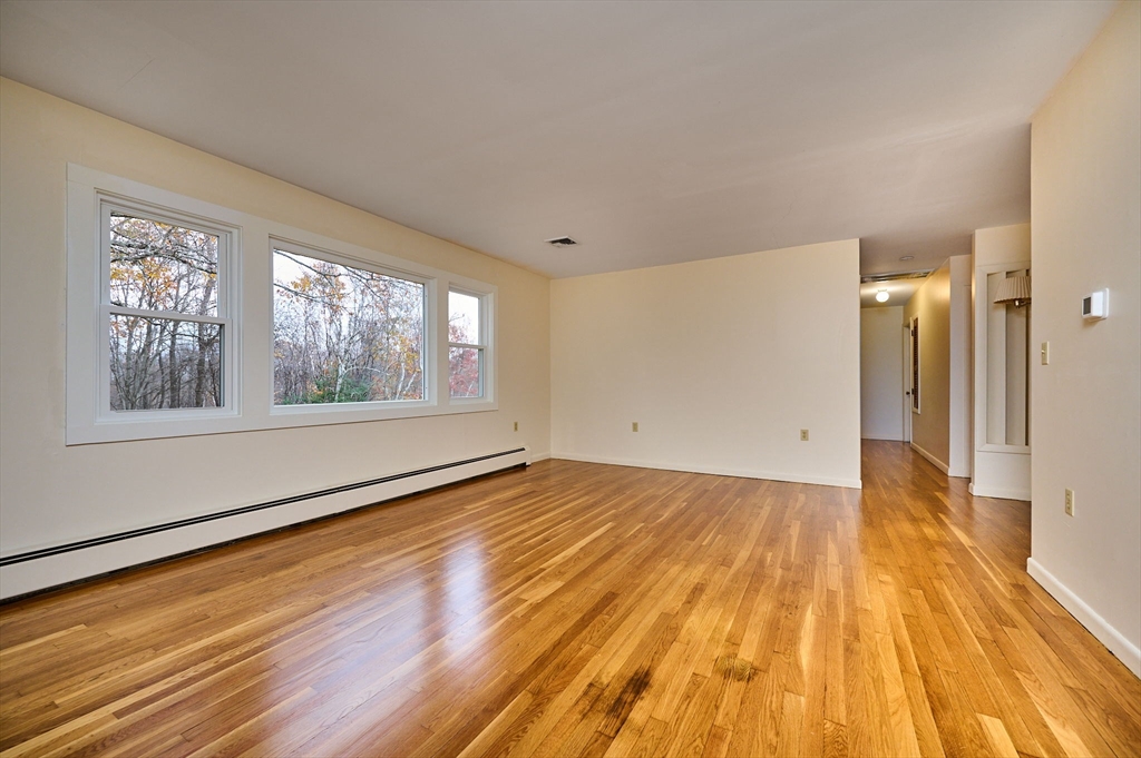 72 North Main Street New Salem, MA 01355 - Photo 6 of 29 a view of empty room with wooden floor and fan
