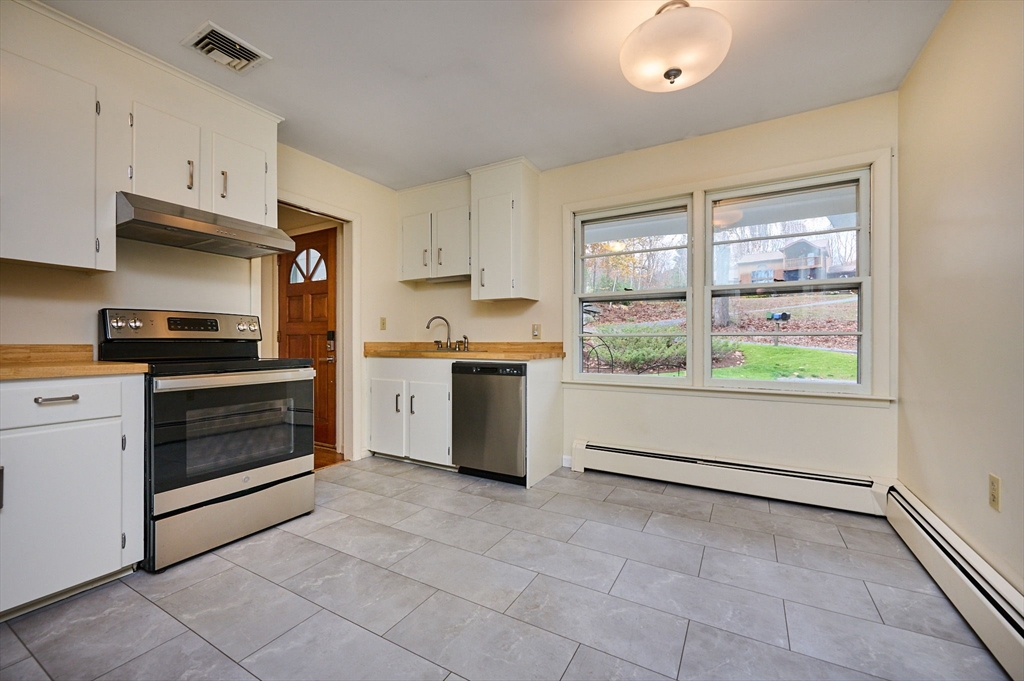 72 North Main Street New Salem, MA 01355 - Photo 7 of 29 a kitchen with a stove oven and a counter top space