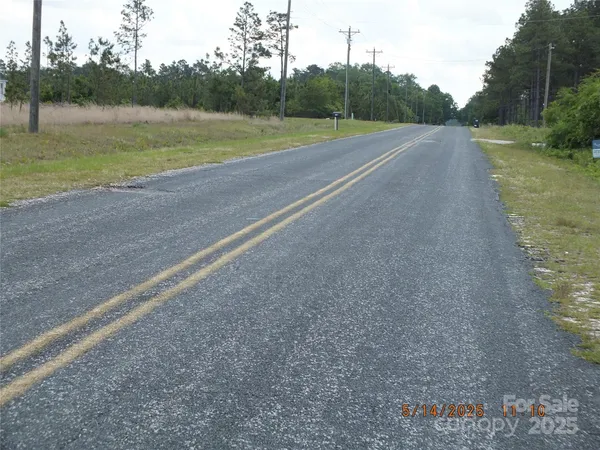 a view of a field with a small yard