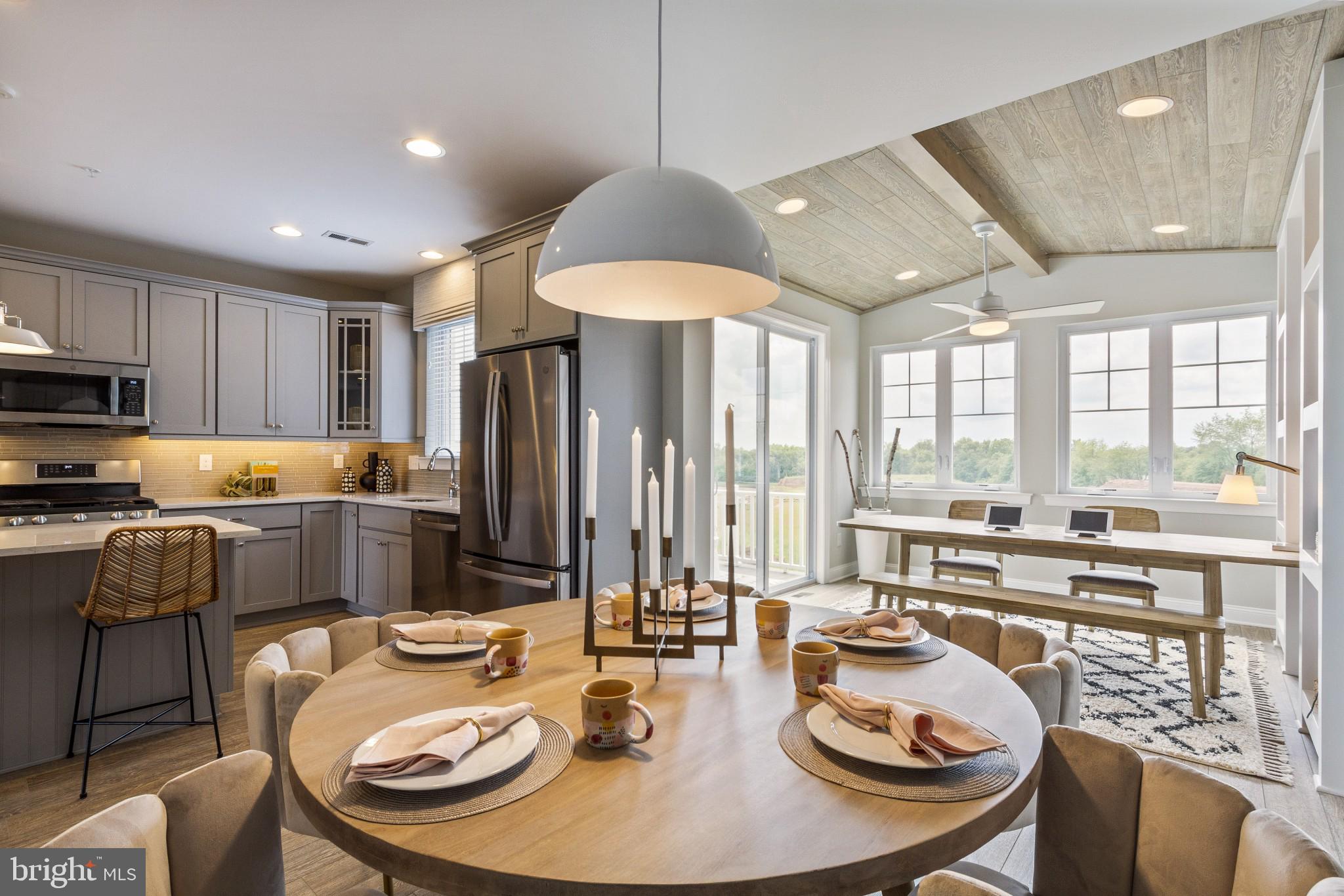 2 Jameson Way, Unit BASE Chalfont, PA 18914 - Photo 17 of 34 a kitchen with sink refrigerator dining table and chairs