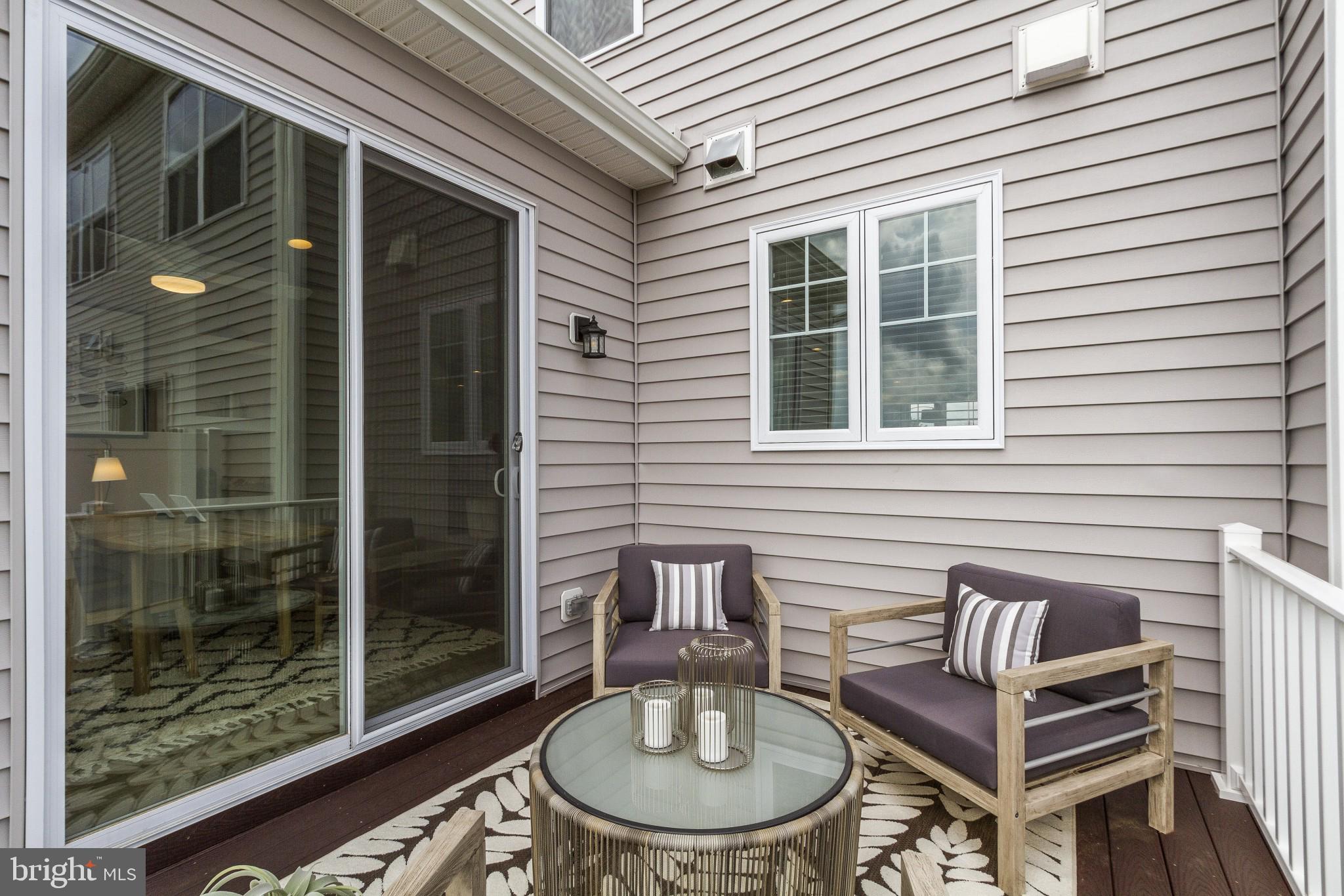 2 Jameson Way, Unit BASE Chalfont, PA 18914 - Photo 19 of 34 a balcony with table and chairs