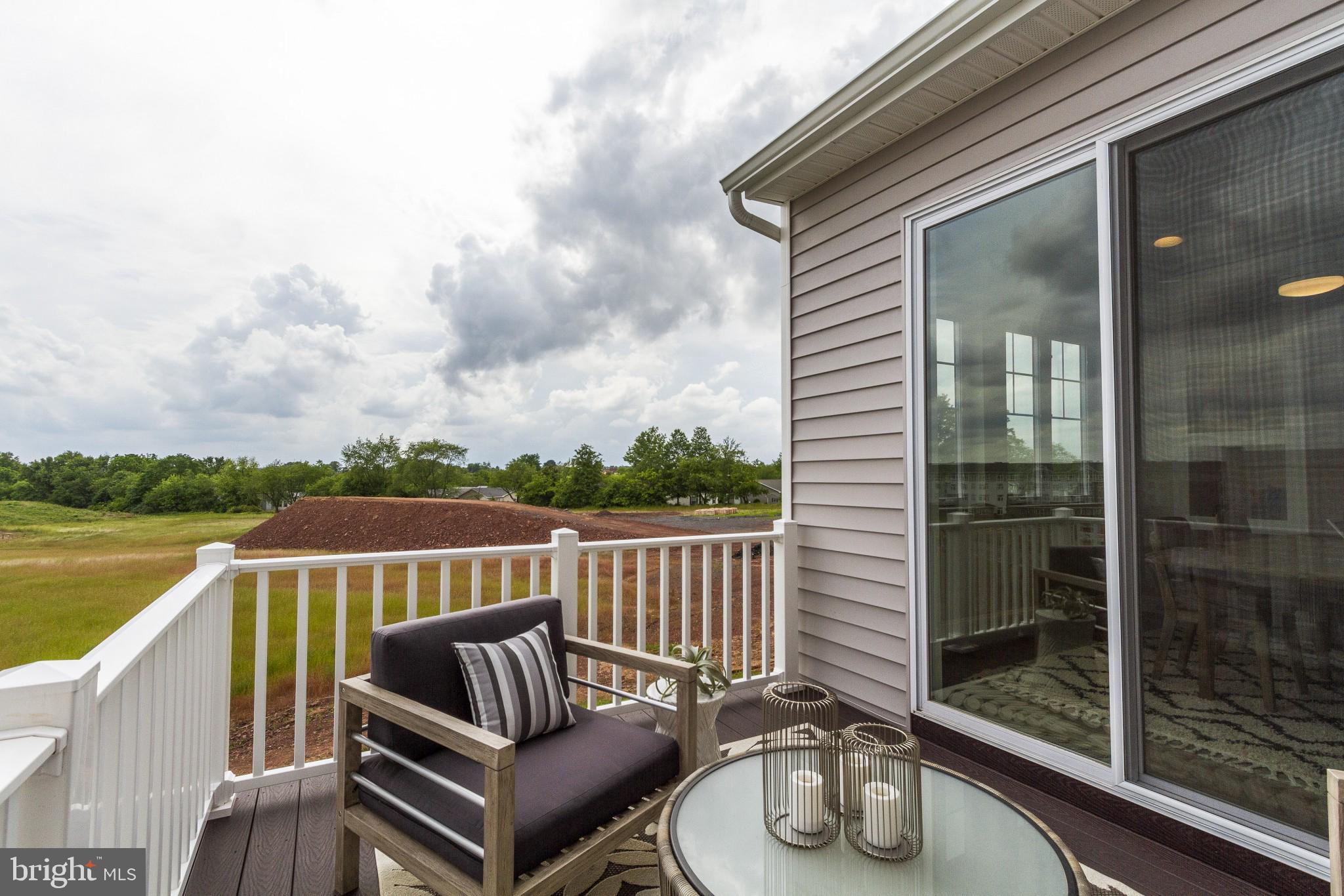 2 Jameson Way, Unit BASE Chalfont, PA 18914 - Photo 20 of 34 a view of roof deck with couches and wooden floor