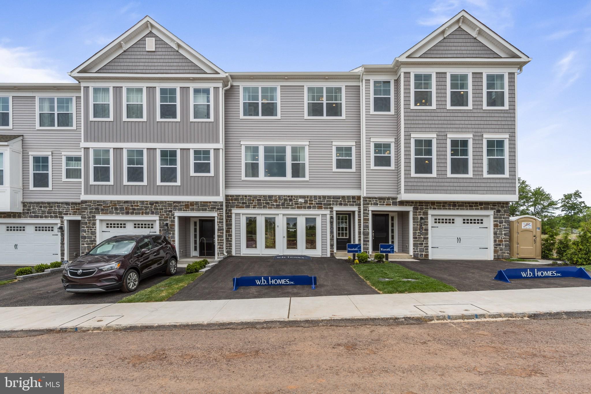 2 Jameson Way, Unit BASE Chalfont, PA 18914 - Photo 2 of 34 a front view of a building with a yard and parking space