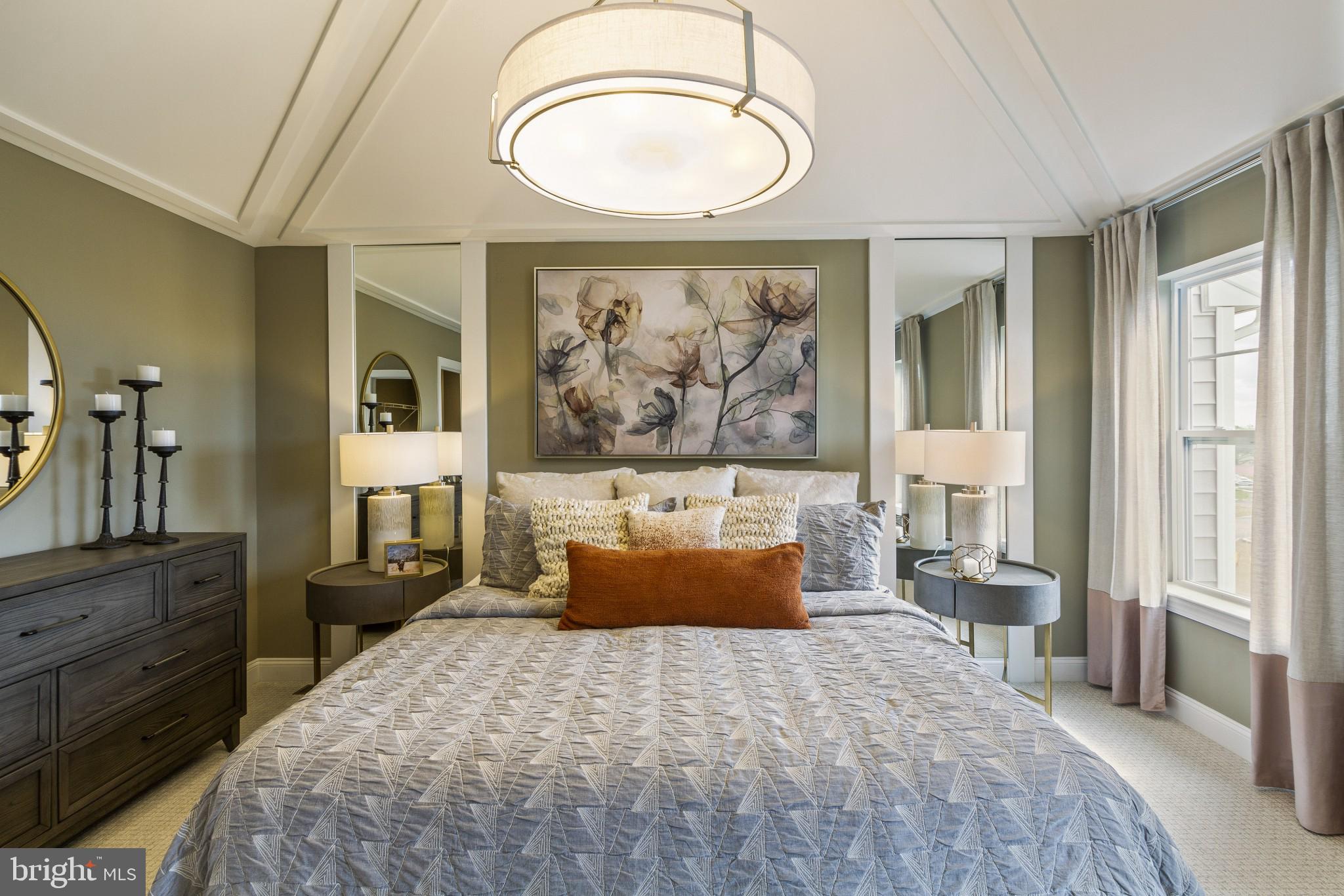 2 Jameson Way, Unit BASE Chalfont, PA 18914 - Photo 23 of 34 a bedroom with a large bed and a chandelier