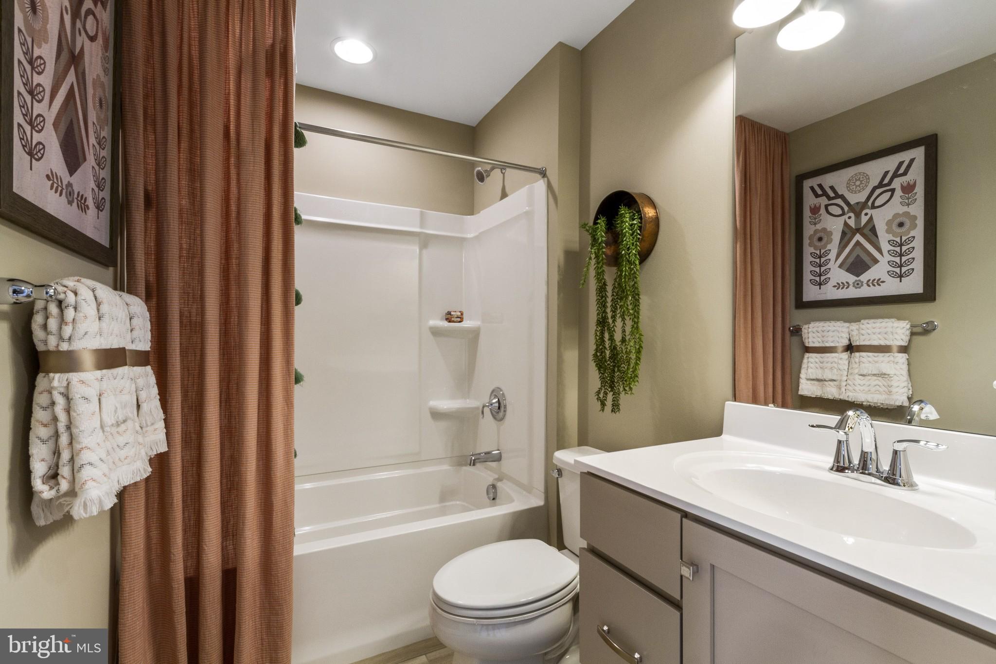 2 Jameson Way, Unit BASE Chalfont, PA 18914 - Photo 29 of 34 a bathroom with a sink a toilet and shower