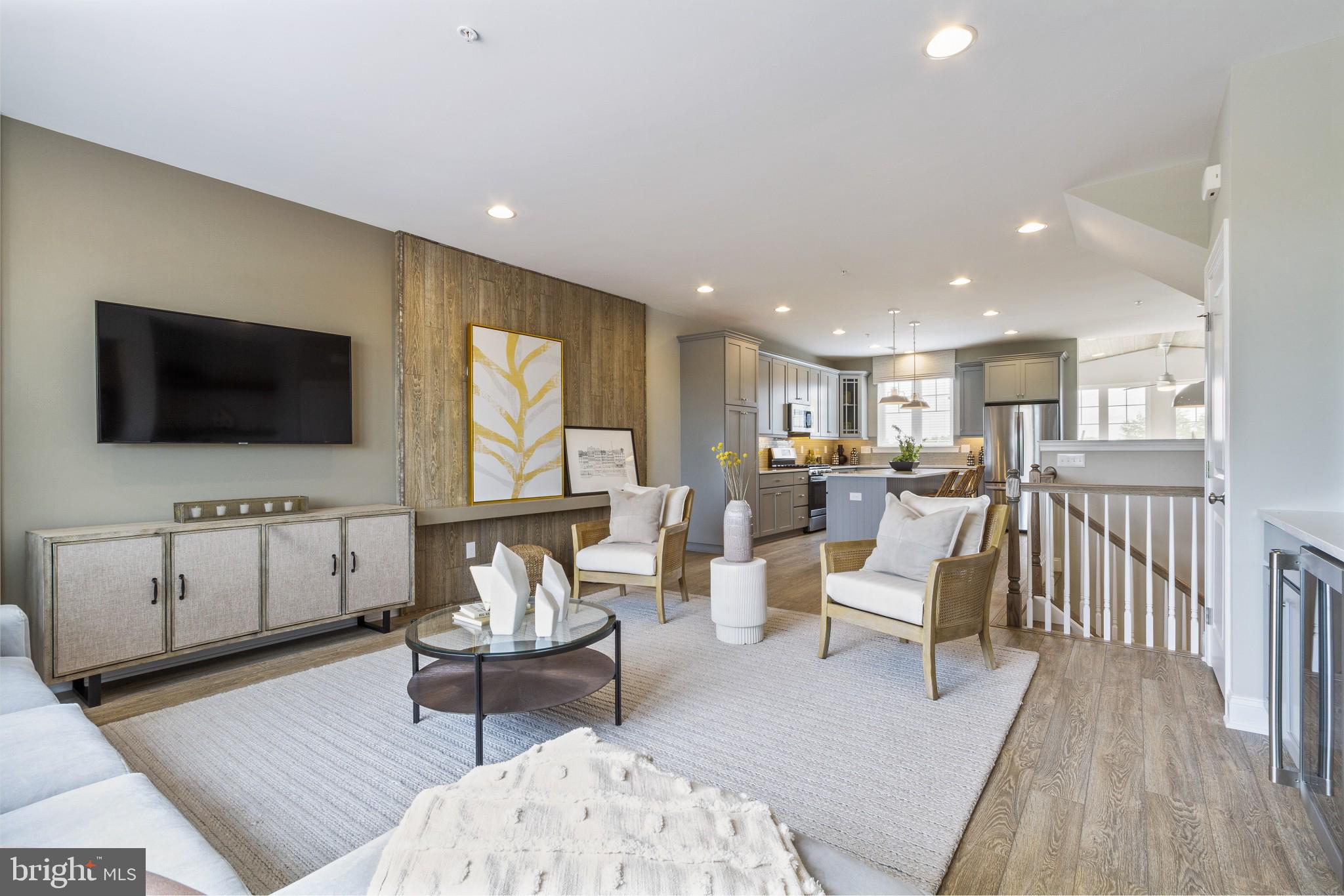 2 Jameson Way, Unit BASE Chalfont, PA 18914 - Photo 8 of 34 a living room with furniture and a flat screen tv