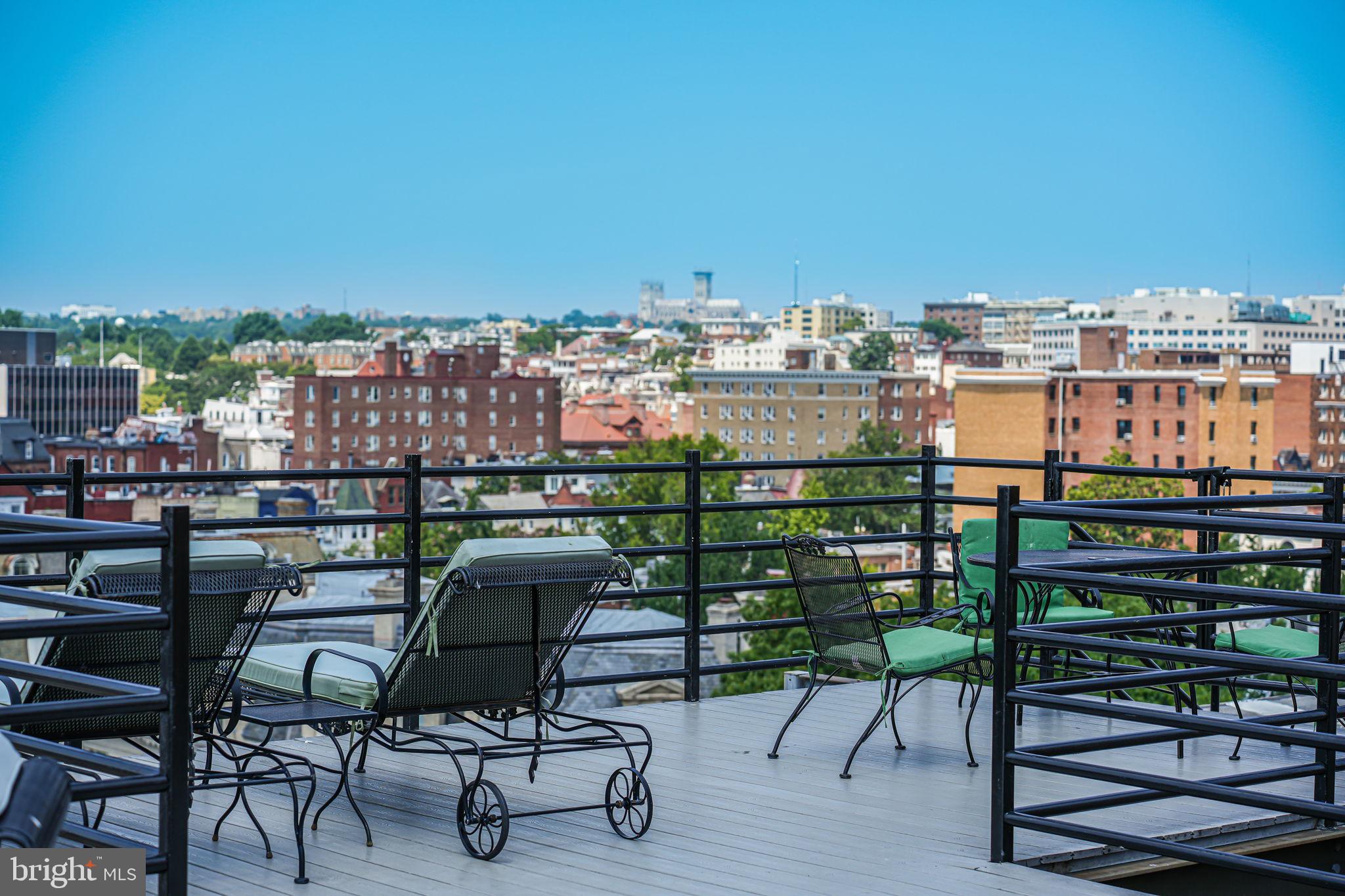 1545 18th Street Northwest, Unit 411 Washington, DC 20036 - Photo 14 of 37 a view of a chairs and table in a balcony