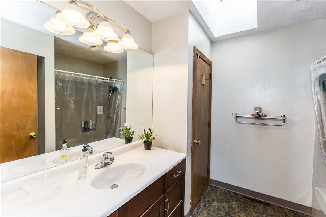 94 Toll Gate Road Warwick, RI 02886 - Photo 20 of 31 Full bath with tub and shower and skylight brings in extra light!
