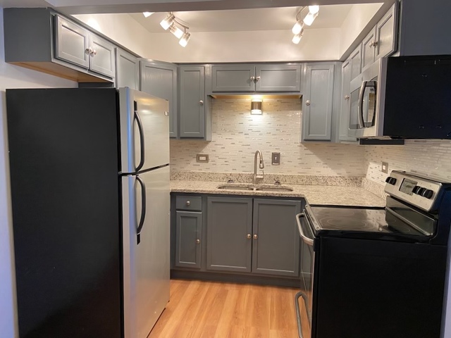 903 Elder Road, Unit 4 Homewood, IL 60430 - Photo 5 of 17 a kitchen with a refrigerator sink and stove
