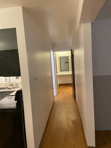 903 Elder Road, Unit 4 Homewood, IL 60430 - Photo 7 of 17 a view of a hallway with wooden floor and staircase