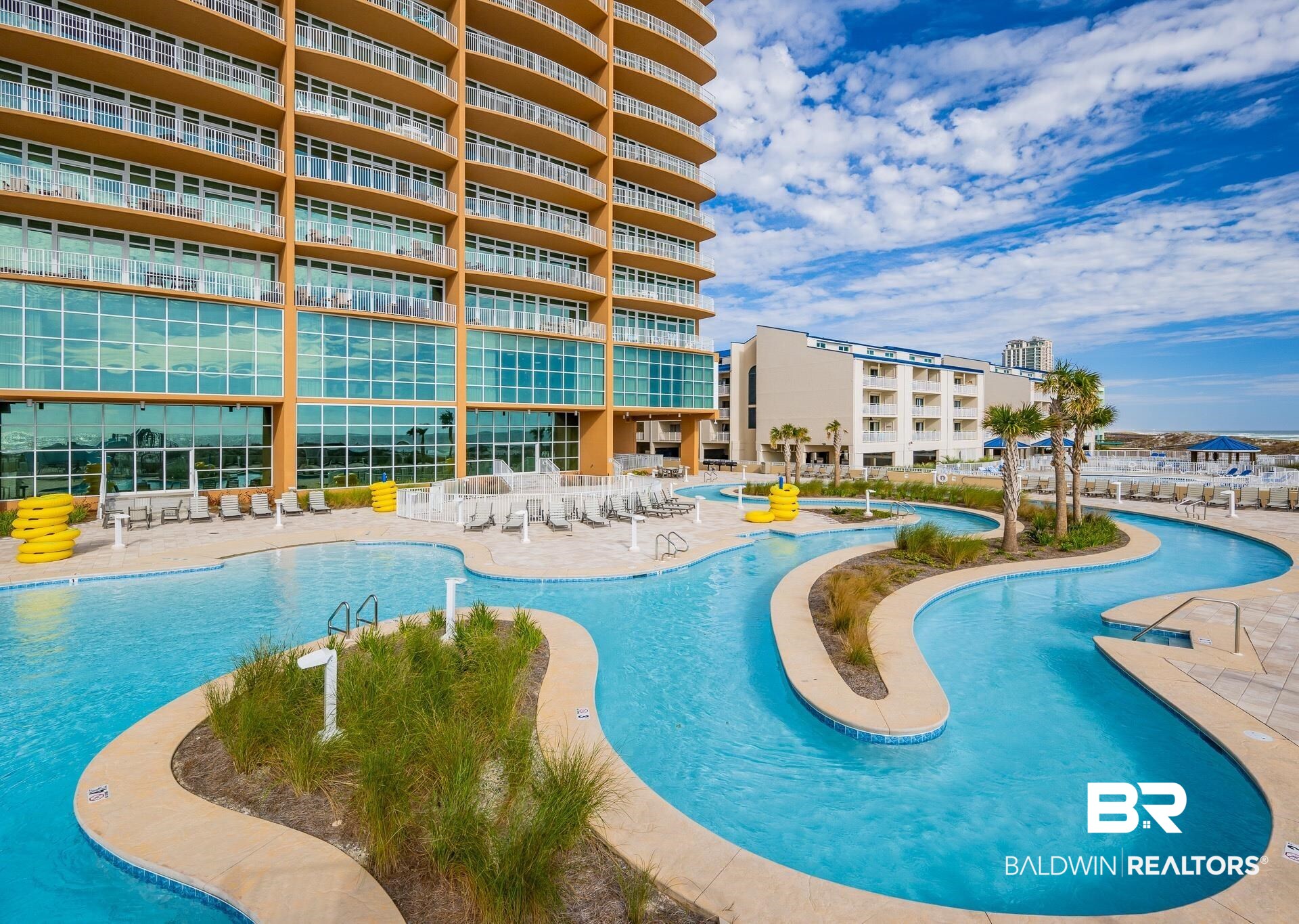 23008 Perdido Beach Boulevard, Unit 506 Orange Beach, AL 36561 - Photo 27 of 48 Community pool featuring a patio area