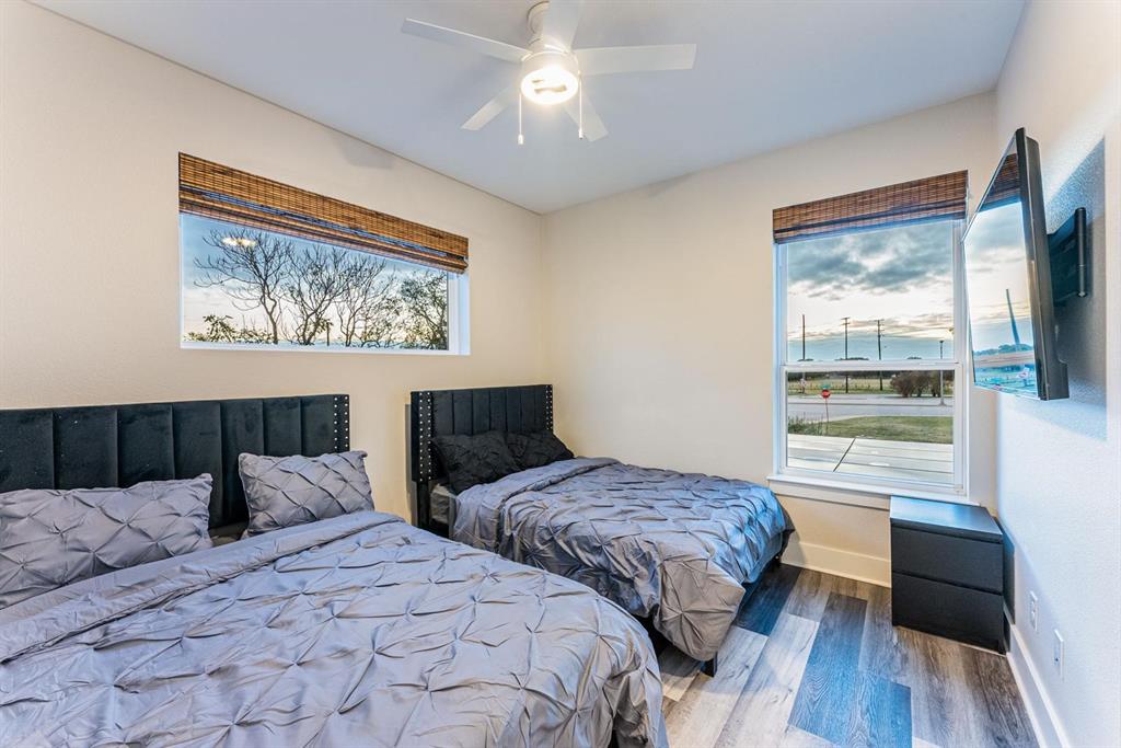 4013 Ivanhoe Lane Dallas, TX 75212 - Photo 33 of 38 Bedroom with hardwood / wood-style floors and ceiling fan