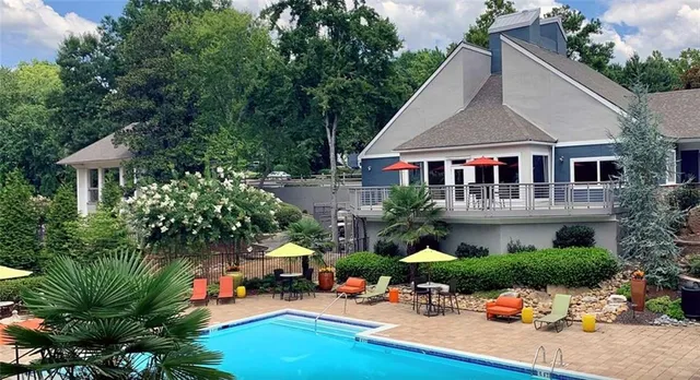 a front view of a house with outdoor seating