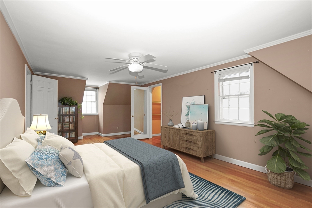 33 Severn Street Longmeadow, MA 01106 - Photo 20 of 42 a bedroom with a bed and a chandelier