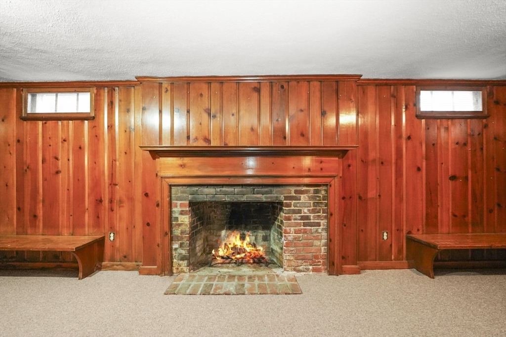 33 Severn Street Longmeadow, MA 01106 - Photo 31 of 42 a living room with furniture and a fireplace
