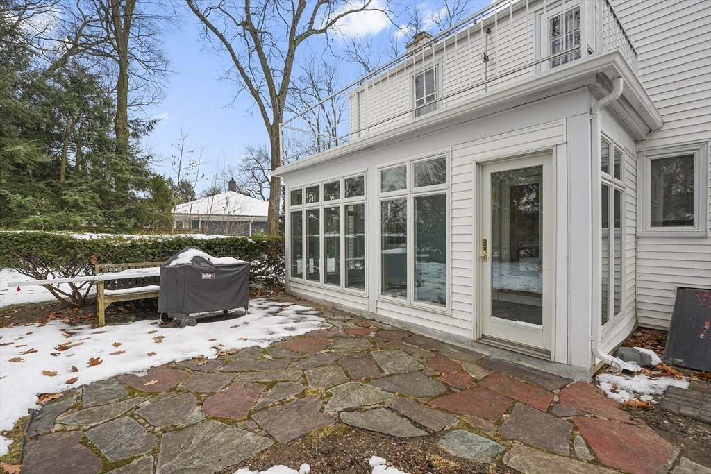 33 Severn Street Longmeadow, MA 01106 - Photo 37 of 42 a view of a patio with table and chairs and floor to ceiling window