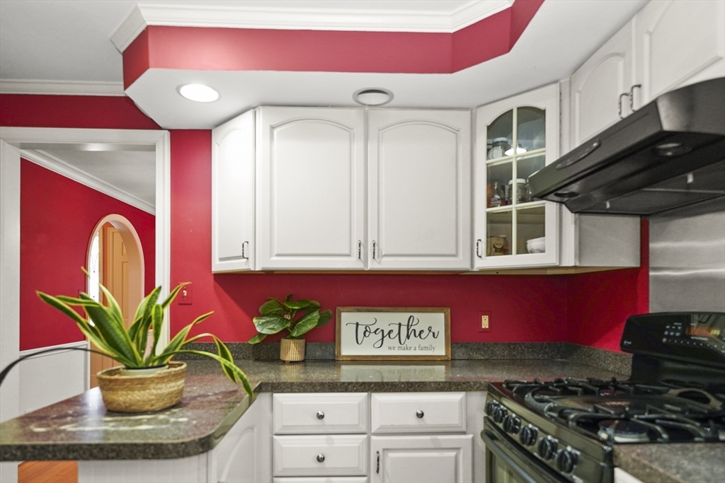 33 Severn Street Longmeadow, MA 01106 - Photo 5 of 42 a kitchen with stainless steel appliances granite countertop a stove a microwave and cabinets