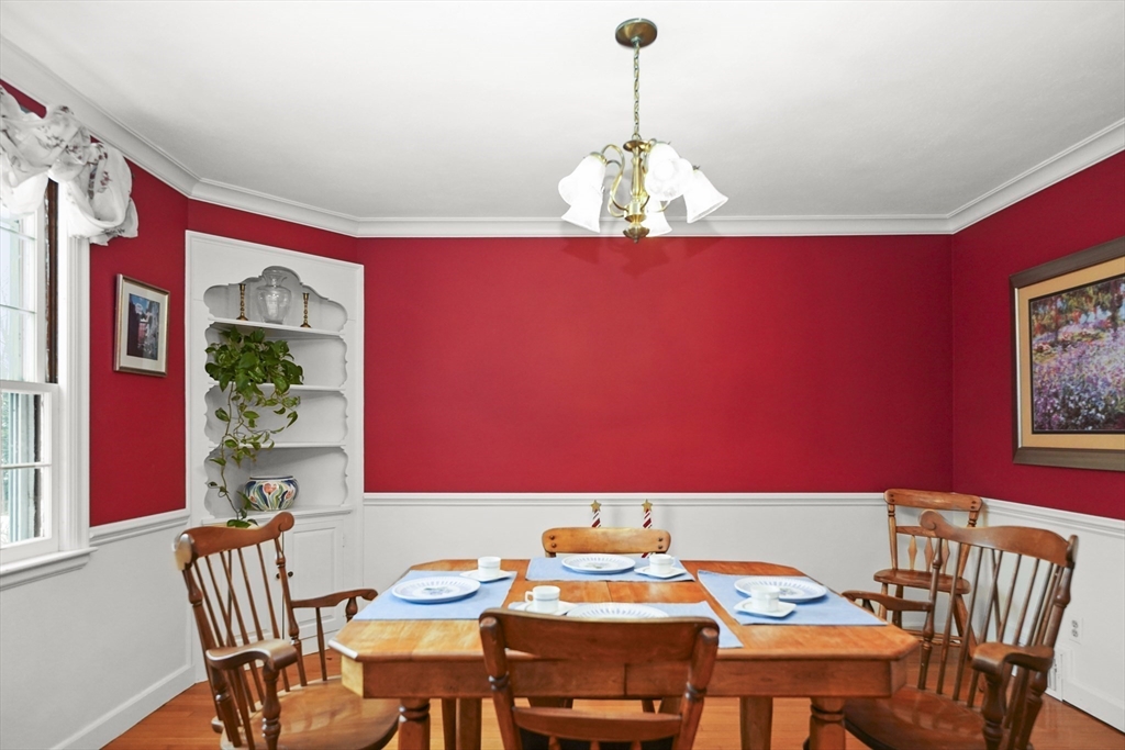 33 Severn Street Longmeadow, MA 01106 - Photo 7 of 42 a view of a dining room with furniture a chandelier and wooden floor