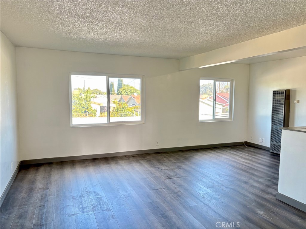 8641 Cerritos Avenue, Unit F Stanton, CA 90680 - Photo 3 of 8 a view of an empty room window and wooden floor
