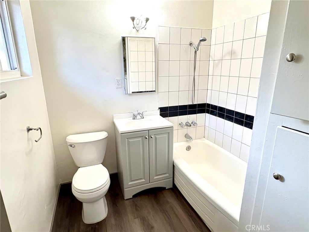 8641 Cerritos Avenue, Unit F Stanton, CA 90680 - Photo 5 of 8 a bathroom with a sink toilet and shower