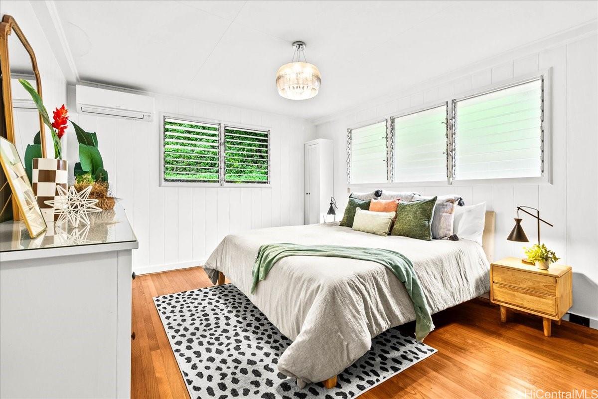 238 Puiwa Road Honolulu, HI 96817 - Photo 7 of 25 Spacious, light filled primary bedroom with wood floors and split A/C.
