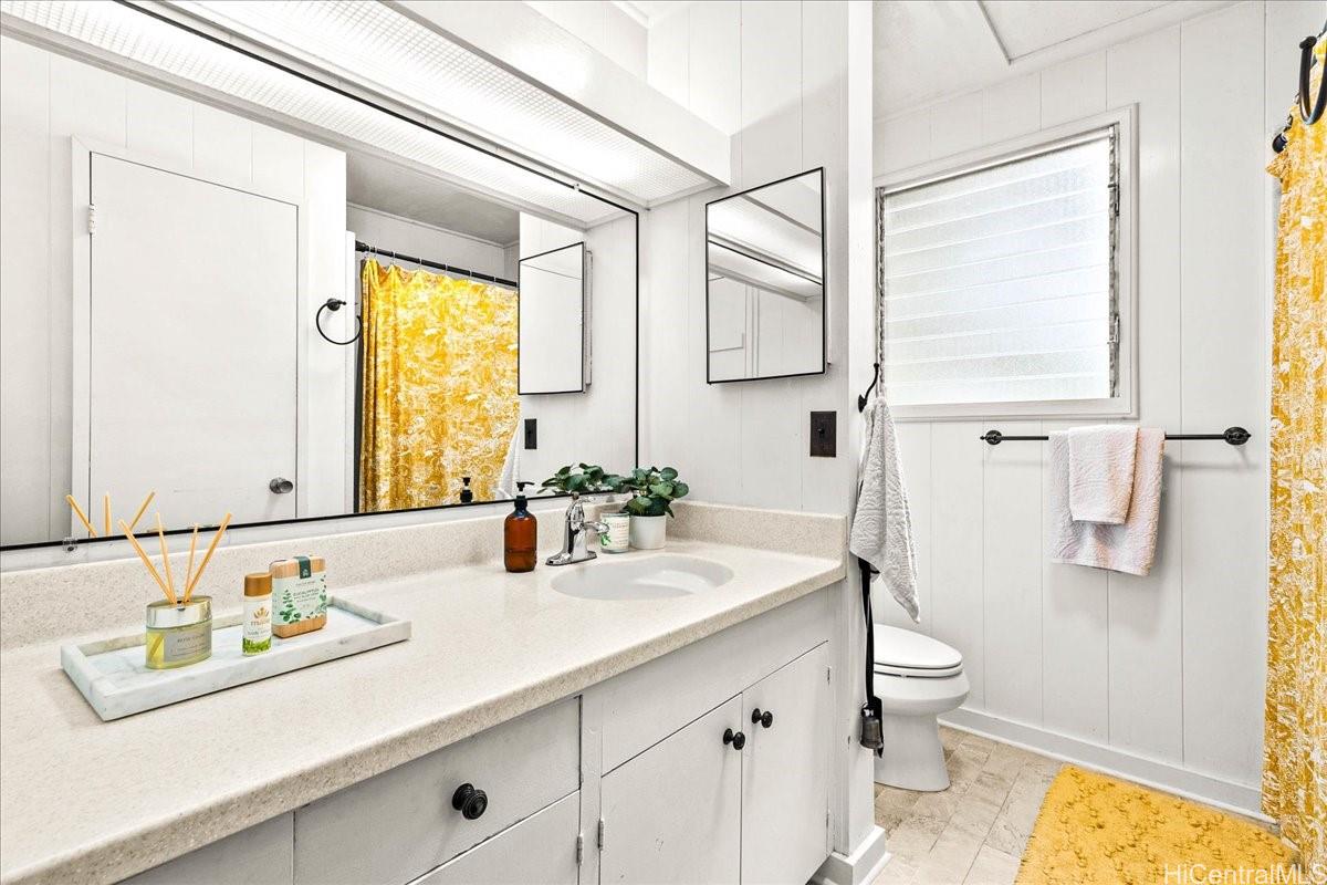 238 Puiwa Road Honolulu, HI 96817 - Photo 8 of 25 Bright bathroom with lots of storage and bathtub/shower.