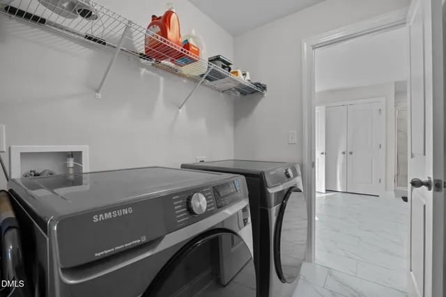 a view of entryway with wooden floor and stairs