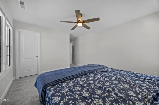 a bathroom with a double vanity sink and mirror