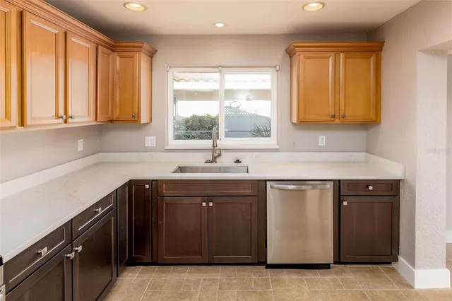 a kitchen with a sink and a window