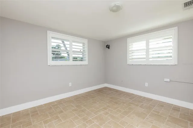 a view of a room with tiles and windows