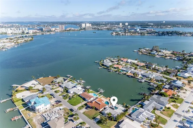 an aerial view of lake and houses with outdoor space