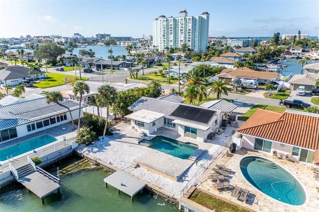 a view of a city with lawn chairs and a big yard