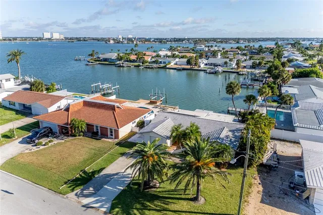 an aerial view of a house with a lake view