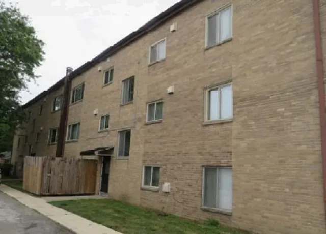 a front view of a house with garage