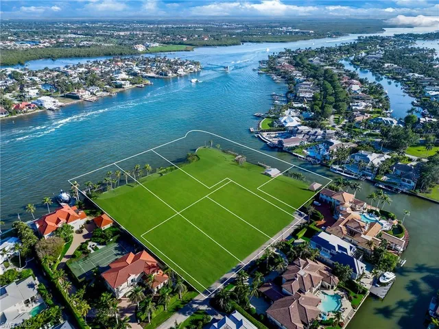 a view of a lake with a building in the background