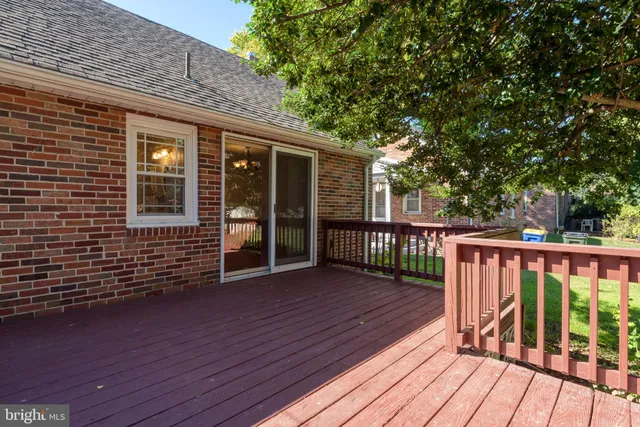 a view of a house with wooden deck