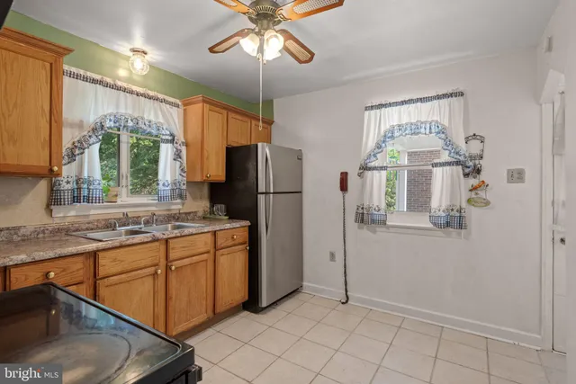 a kitchen with stainless steel appliances a refrigerator and a sink