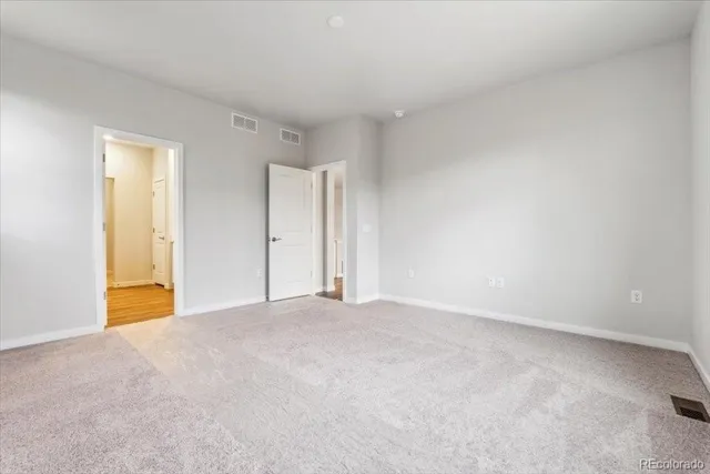 a view of an empty room and window