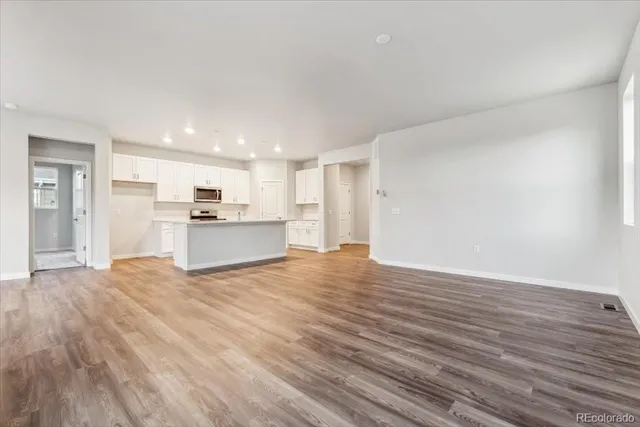 a view of a kitchen with a sink and a stove top oven