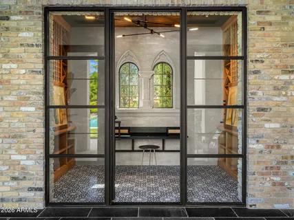 a living room with furniture a rug and a window
