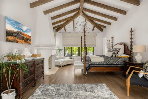 a dining room with a window and chairs