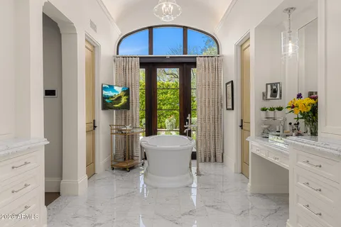 a bathroom with a granite countertop sink mirror and shower