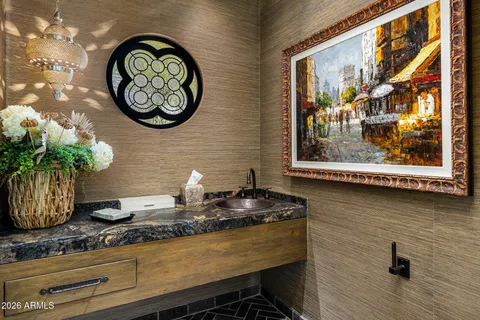 a living room with fireplace furniture and a large window