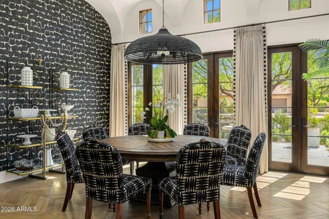 a dining room with a table and chairs