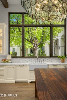 a dining room with a table and chairs