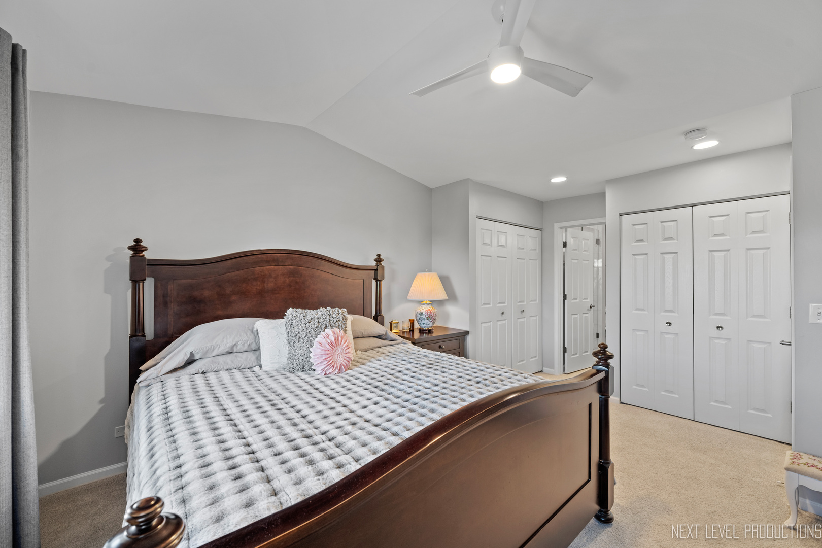 479 River Bend Road, Unit 111 Naperville, IL 60540 - Photo 14 of 25 a bedroom with a bed and a lamp